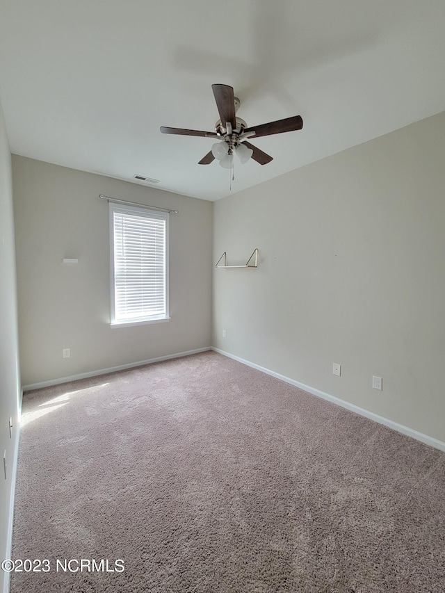 spare room with carpet flooring and ceiling fan