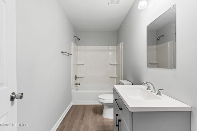 full bathroom with vanity, toilet, hardwood / wood-style flooring, and shower / bathing tub combination