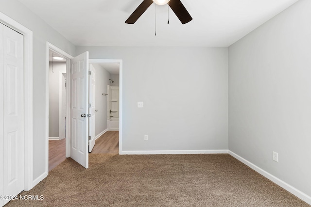 unfurnished bedroom featuring carpet flooring and ceiling fan