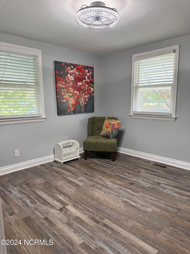 living area with dark hardwood / wood-style floors