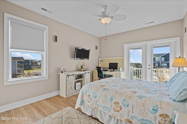 bedroom featuring visible vents, baseboards, light wood-style flooring, access to exterior, and french doors