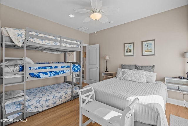 bedroom featuring baseboards, visible vents, a ceiling fan, wood finished floors, and recessed lighting