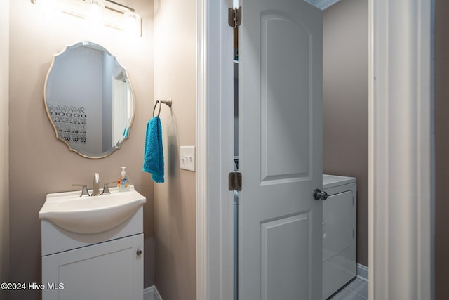 bathroom featuring washer / clothes dryer and vanity