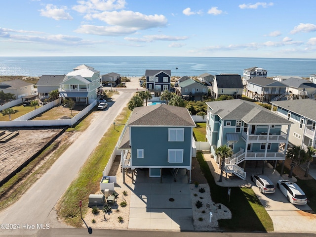 birds eye view of property featuring a water view and a residential view