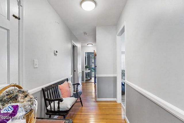 hallway with wood-type flooring