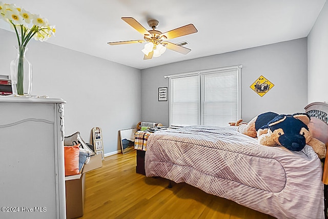 bedroom featuring light hardwood / wood-style flooring and ceiling fan