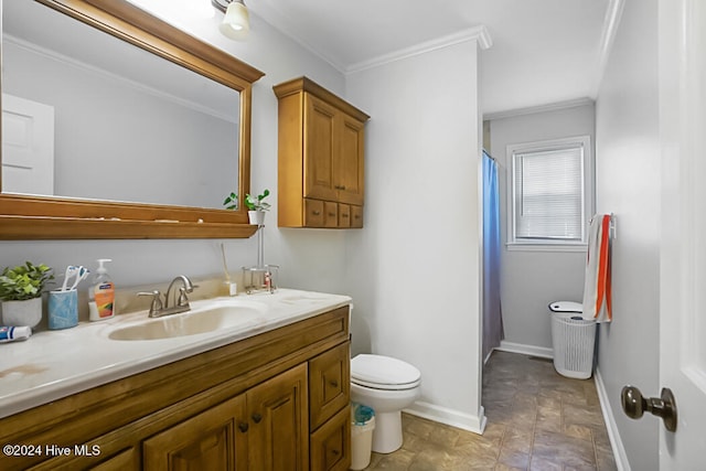 bathroom featuring vanity, ornamental molding, and toilet