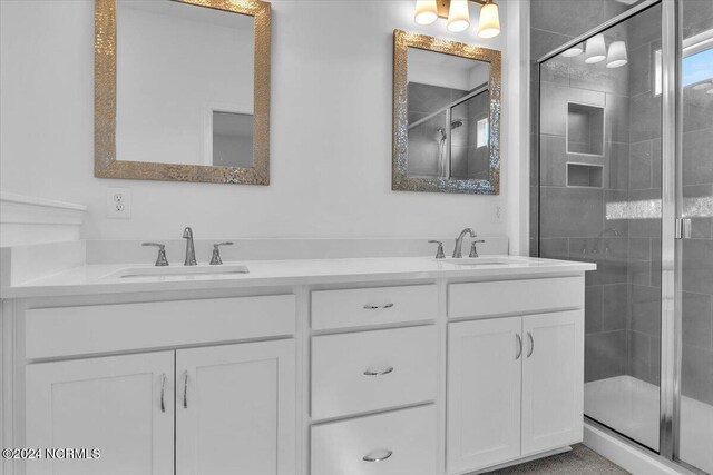 bathroom with vanity and an enclosed shower