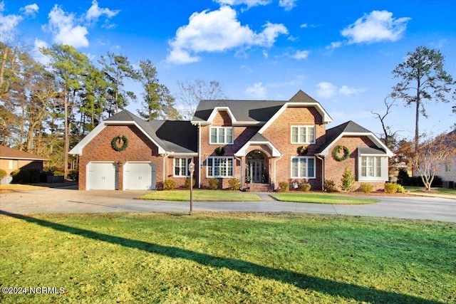 view of property featuring a front lawn