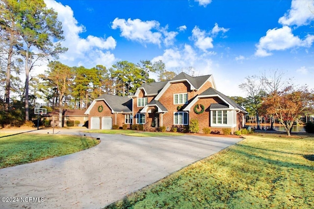 view of front of house featuring a front yard and a garage