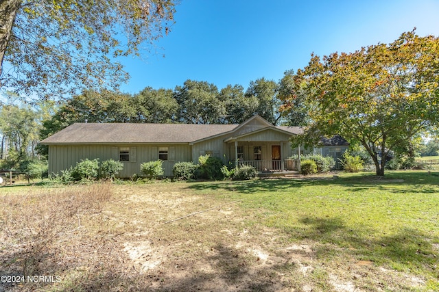 single story home with a front lawn and a porch