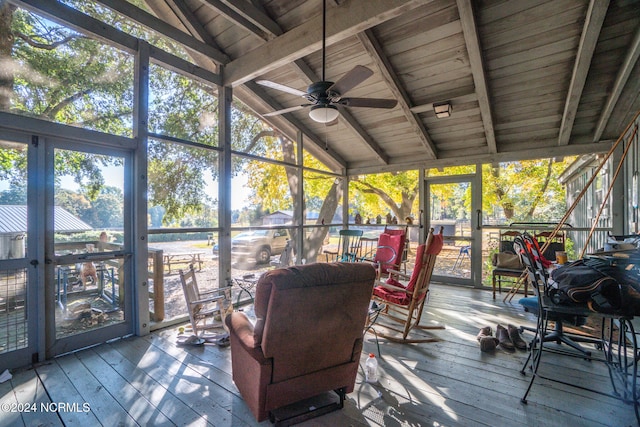 sunroom / solarium featuring vaulted ceiling with beams, wooden ceiling, and ceiling fan