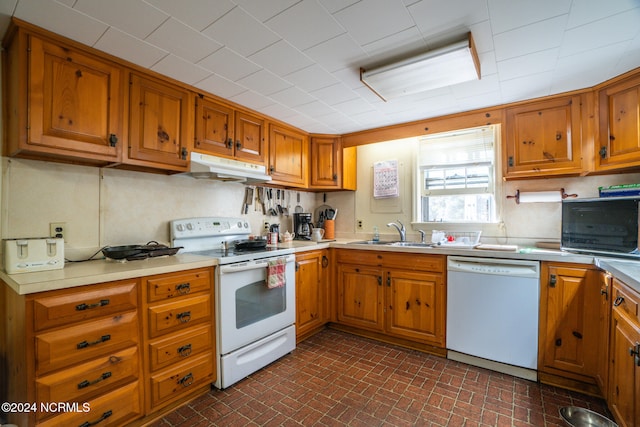 kitchen with sink and white appliances