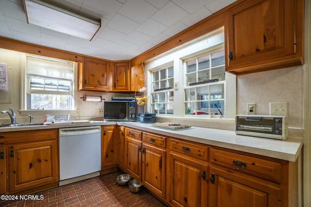 kitchen with white dishwasher and sink