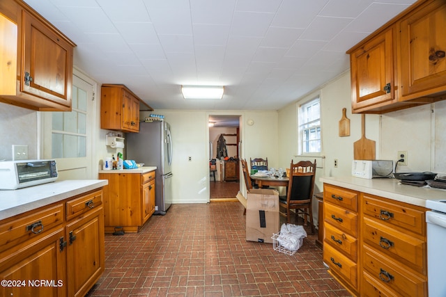 kitchen featuring stainless steel refrigerator