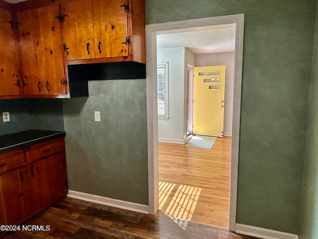 kitchen with dark hardwood / wood-style floors