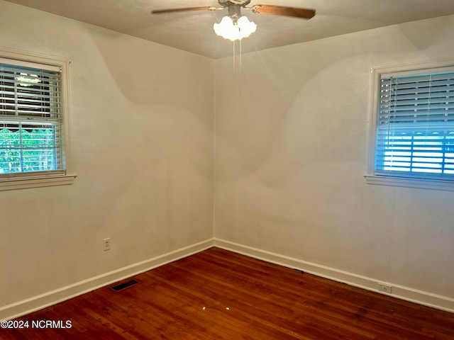 spare room with ceiling fan and wood-type flooring