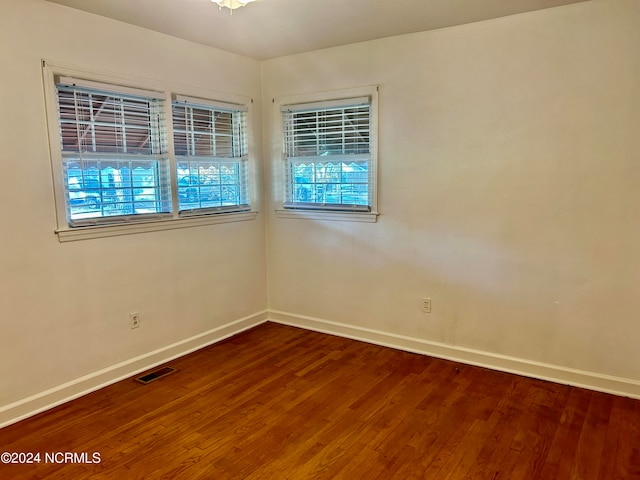 spare room featuring hardwood / wood-style flooring