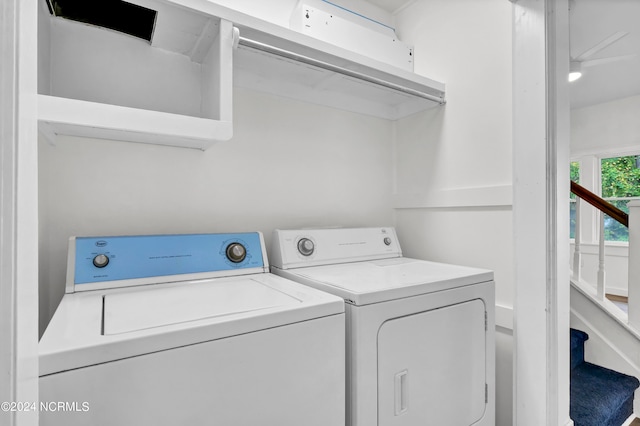 clothes washing area featuring washer and dryer