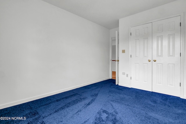 unfurnished bedroom featuring a closet and carpet