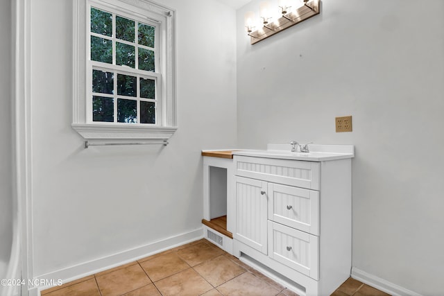 bathroom featuring vanity and tile patterned flooring