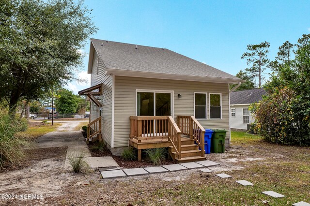 rear view of property with a deck