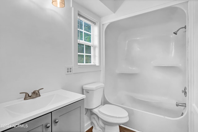 full bathroom featuring toilet, vanity, wood-type flooring, and tub / shower combination