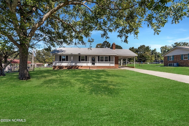 ranch-style house with a front lawn and covered porch