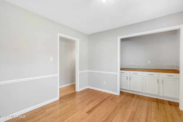 spare room with light wood-type flooring