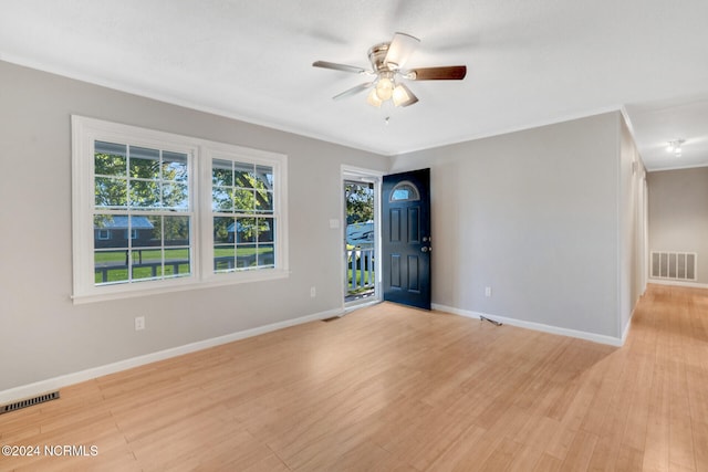 spare room with ceiling fan and light hardwood / wood-style flooring