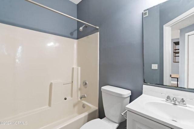 full bathroom featuring vanity, toilet, and washtub / shower combination