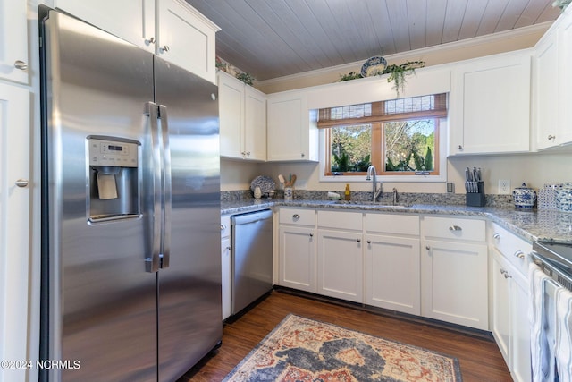 kitchen featuring appliances with stainless steel finishes, sink, white cabinets, light stone counters, and ornamental molding