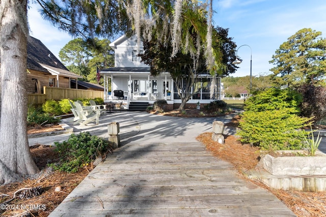 back of house with a porch