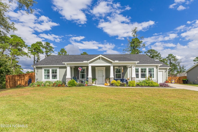 craftsman-style home with a front lawn