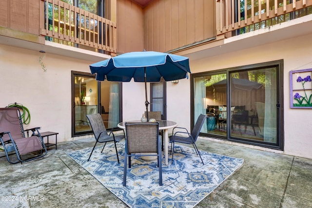 view of patio featuring a balcony