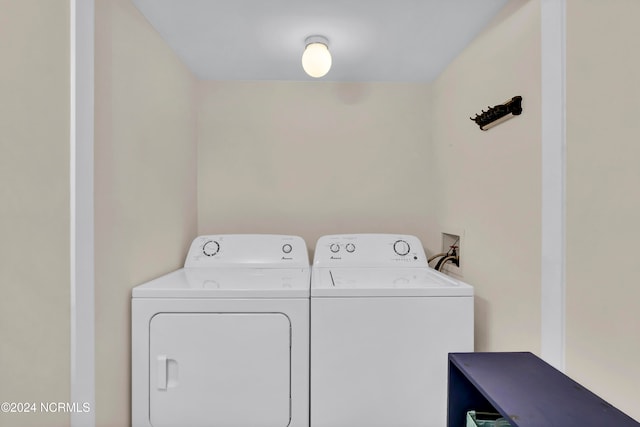 washroom featuring independent washer and dryer