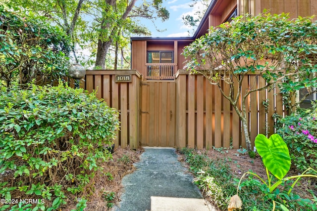 view of gate with fence