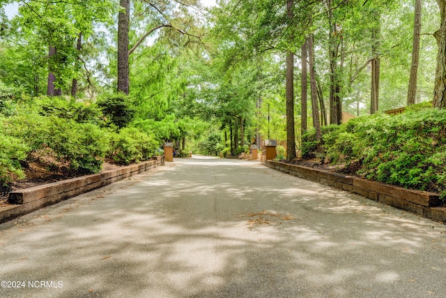 exterior space featuring a forest view