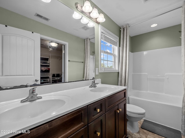 full bathroom featuring vanity, shower / bathtub combination with curtain, and toilet