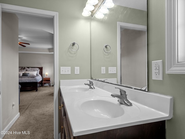 bathroom with ceiling fan and vanity