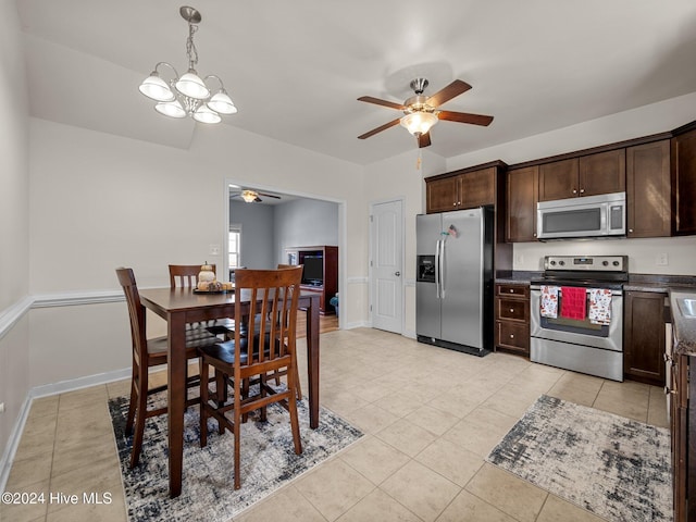 tiled dining room featuring ceiling fan with notable chandelier