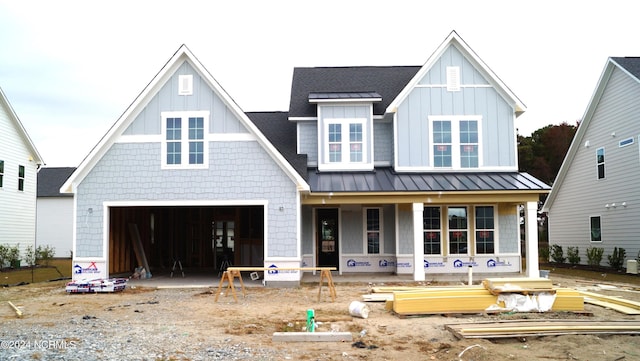 view of front of home with a front yard and a garage