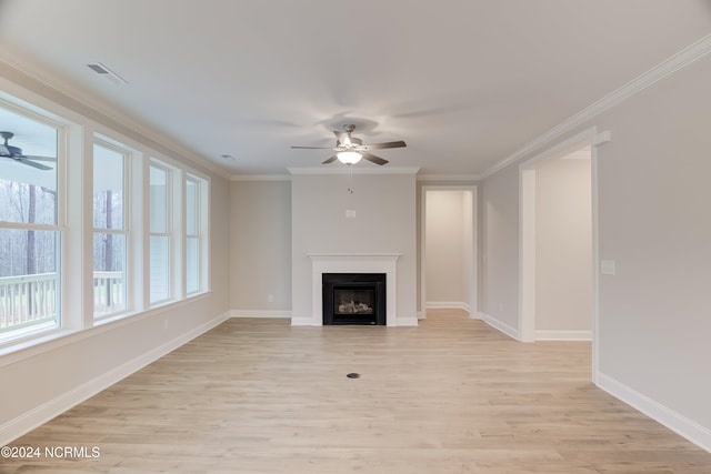 unfurnished living room featuring ceiling fan, crown molding, and light wood-type flooring