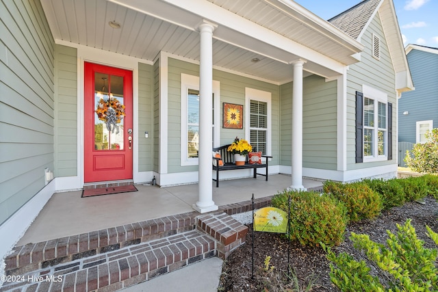 doorway to property with a porch