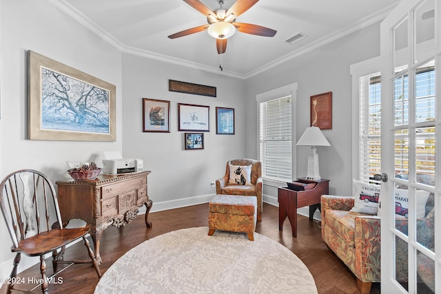 living area featuring ornamental molding, dark hardwood / wood-style floors, and ceiling fan