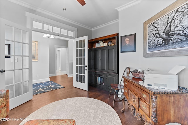 office area featuring french doors, crown molding, dark hardwood / wood-style floors, and ceiling fan