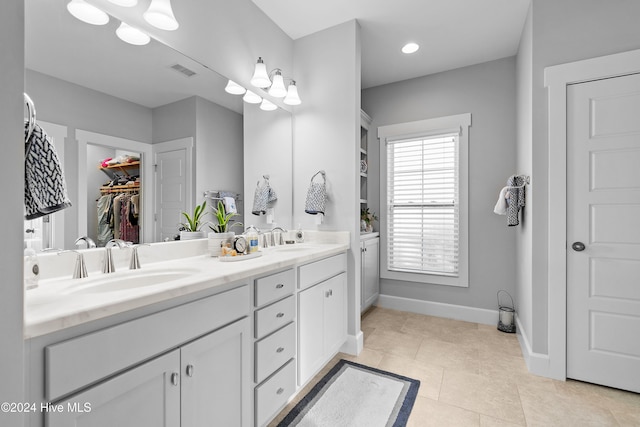 bathroom with vanity and tile patterned floors