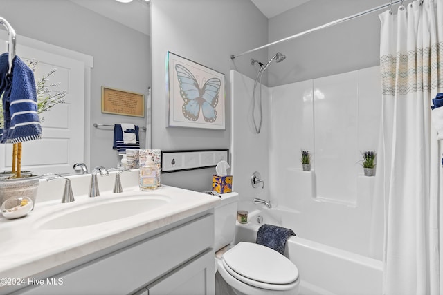 full bathroom with toilet, vanity, and shower / tub combo