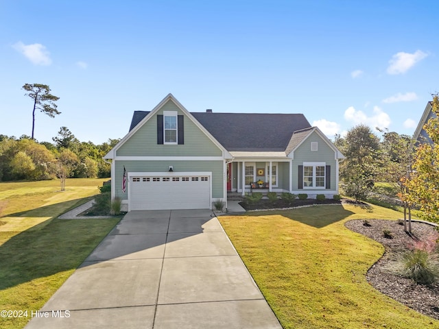 view of front facade with a front yard and a garage