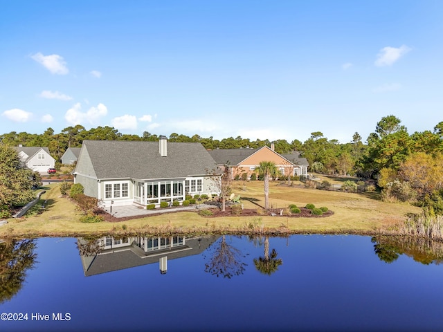 rear view of house with a water view